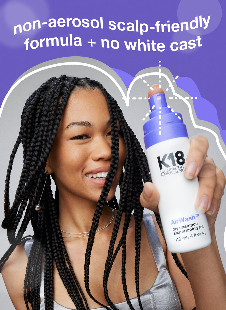 Woman with braided hair holding airwash dry shampoo.