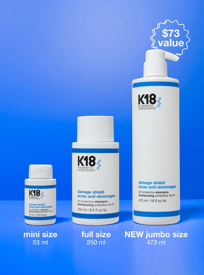 K18 hair care product bottles in various sizes on a blue background