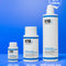 K18 hair care product bottles in various sizes on a blue background