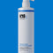K18 shampoo bottle on a blue background