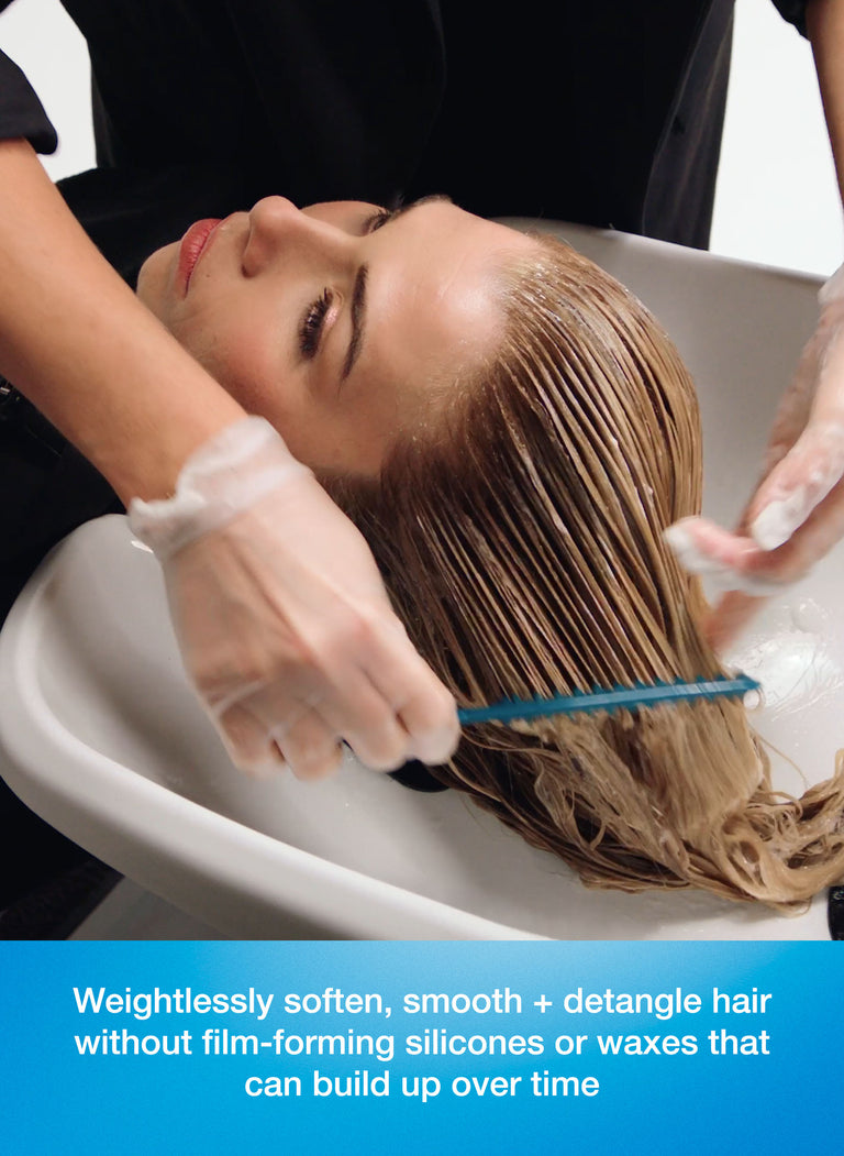 person-getting-hair-washed-with-a-focus-on-hair-care-product-benefits