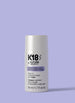 K18 hair mask bottle on a purple background