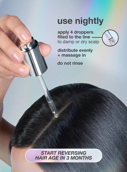 woman applying serum to scalp. 