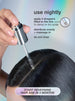 woman applying serum to scalp. 