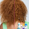 Curly red hair before and after using a k18 hair repair routine. 